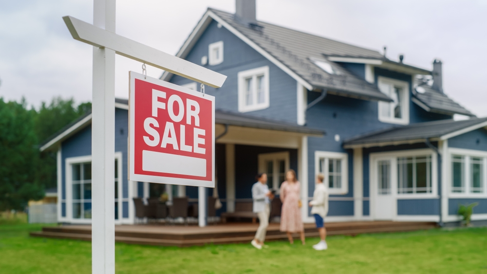young couple looking at a home for sale